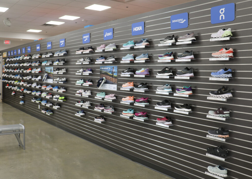 wall of running shoes in RoadRunner Sports